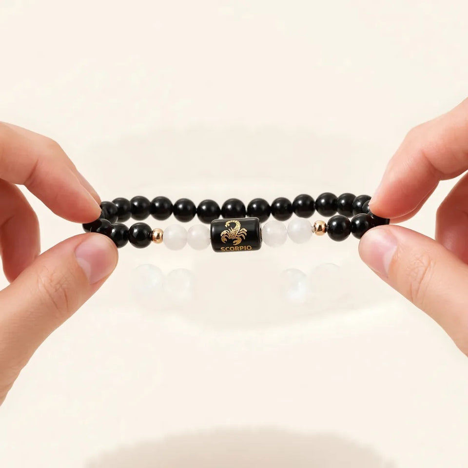 Stretching the Scorpio zodiac bracelet open gently