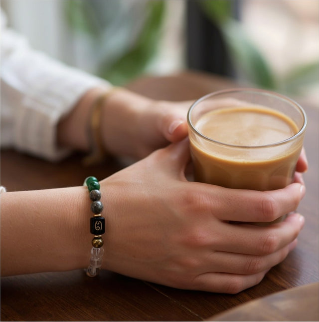 Dhan Yog Bracelet for Cancer, everyday, with a coffee