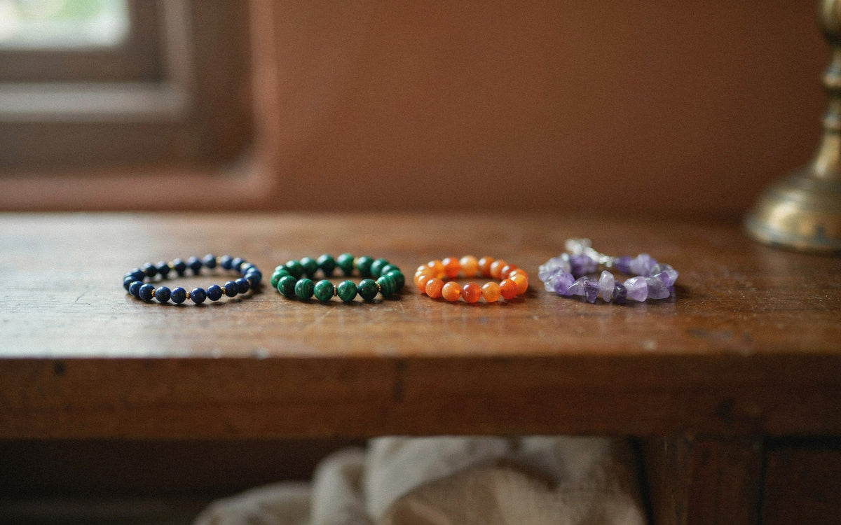 Four gemstone bracelets in blue