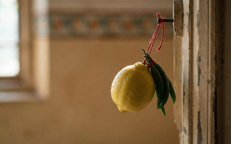 A nimbu-mirchi charm of a lemon and green chillies hung