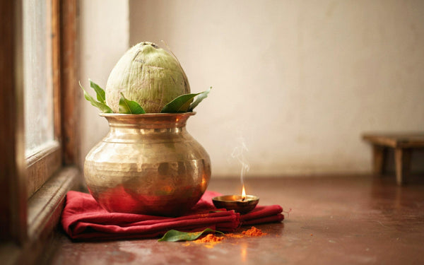 Navratri kalash with coconut and mango leaves