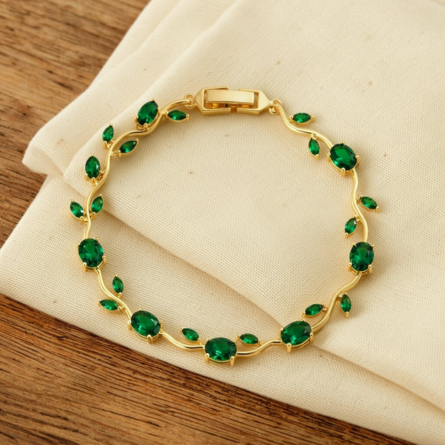 Green tulip bracelet resting on a dry cream cotton cloth