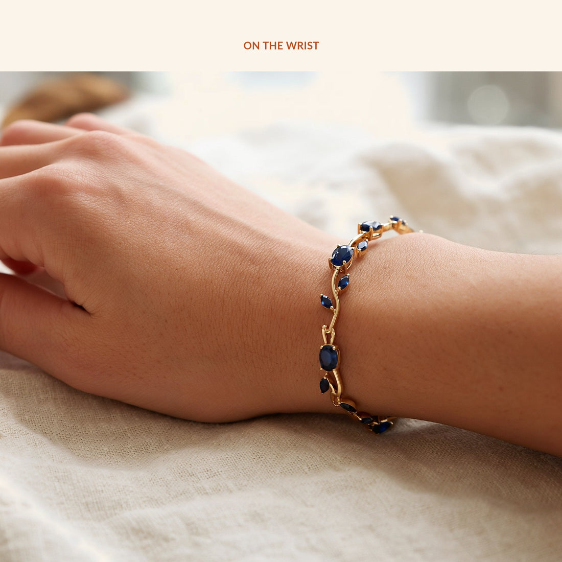 Blue Tulip Gold Tone Bracelet, on the wrist