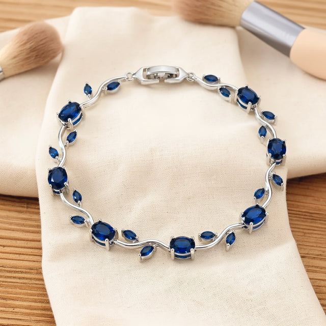 Blue tulip bracelet resting on a dry cream cotton cloth