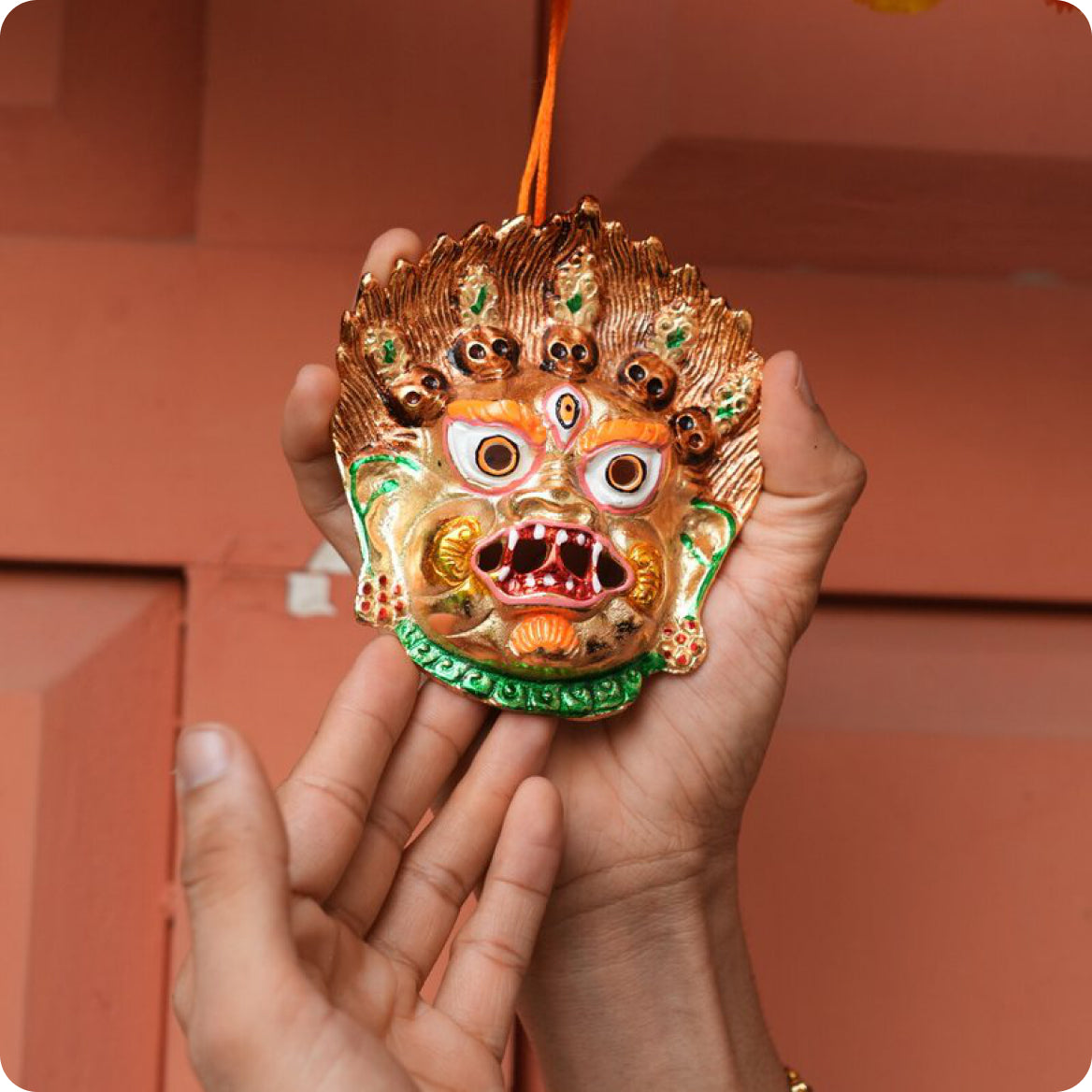 Kirtimukh held in both hands