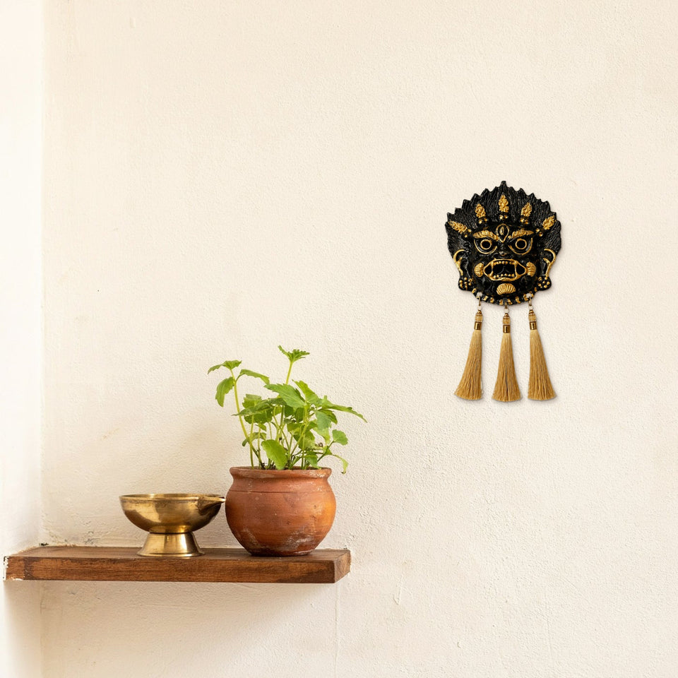 The hanging on the wall beside an entrance shelf