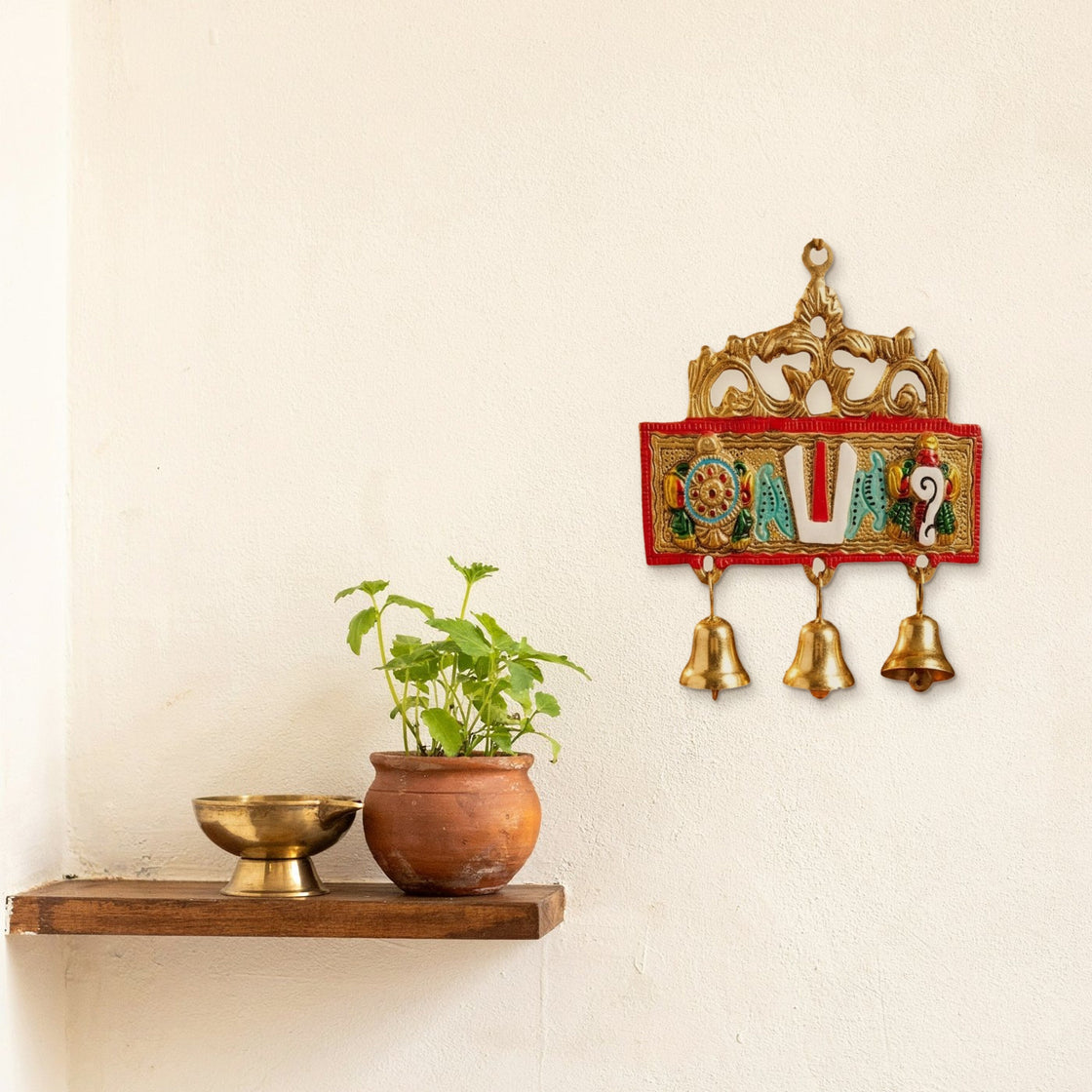 The hanging on the wall beside an entrance shelf