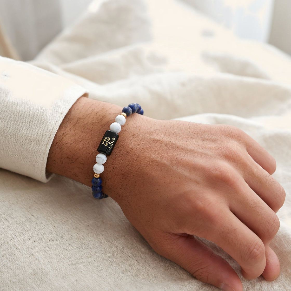Man's wrist wearing a Libra zodiac stone bracelet
