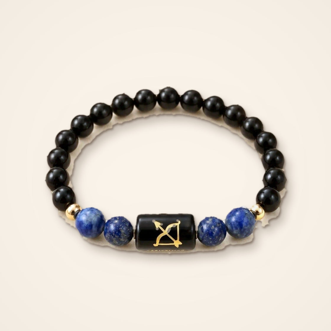 Sagittarius rashi bracelet on a plain cream background