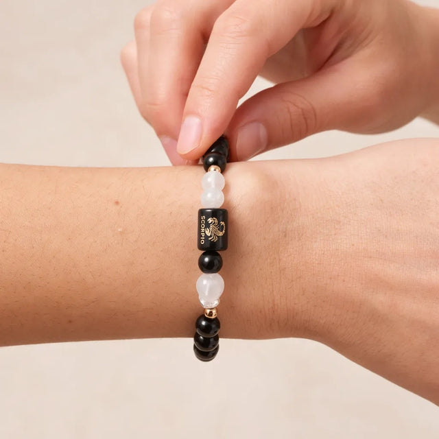 Settling the Scorpio zodiac bracelet on the wrist