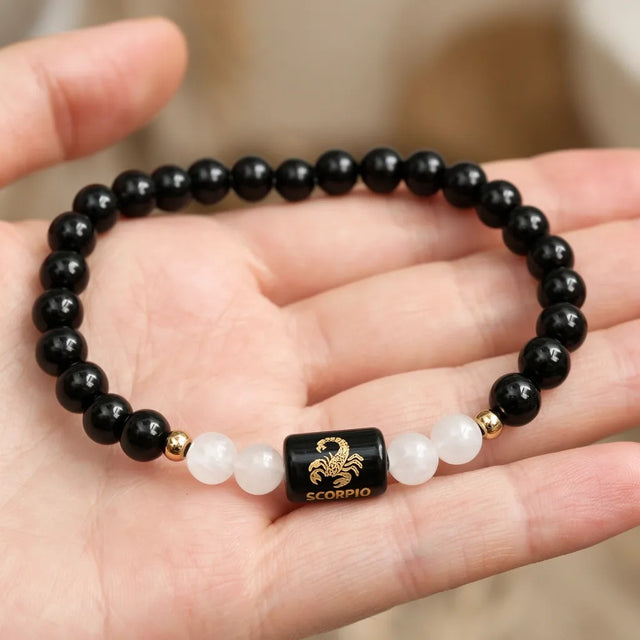 Scorpio zodiac bracelet in an open palm