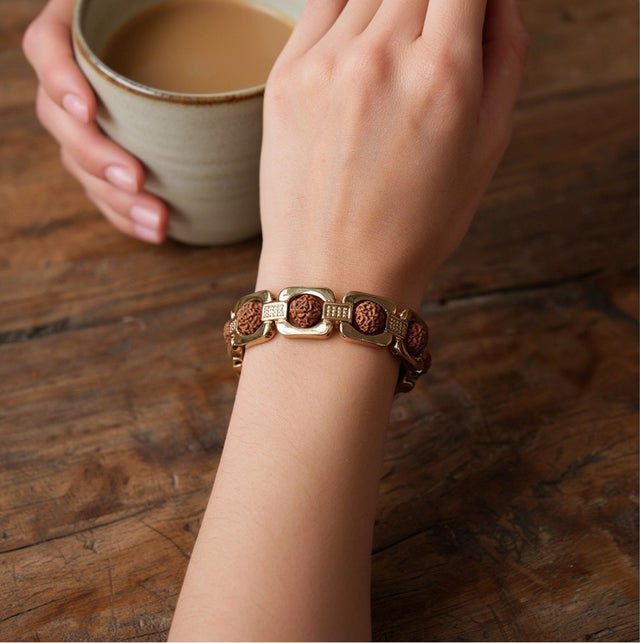 Gold Plated Rudraksha Bracelet, everyday, with a coffee