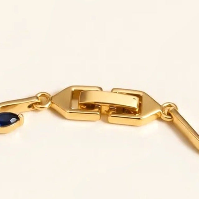 Close view of the fold over clasp on the gold tone tulip bracelet