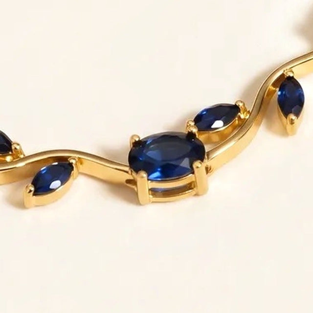 Close view of the stones on the gold tone tulip bracelet