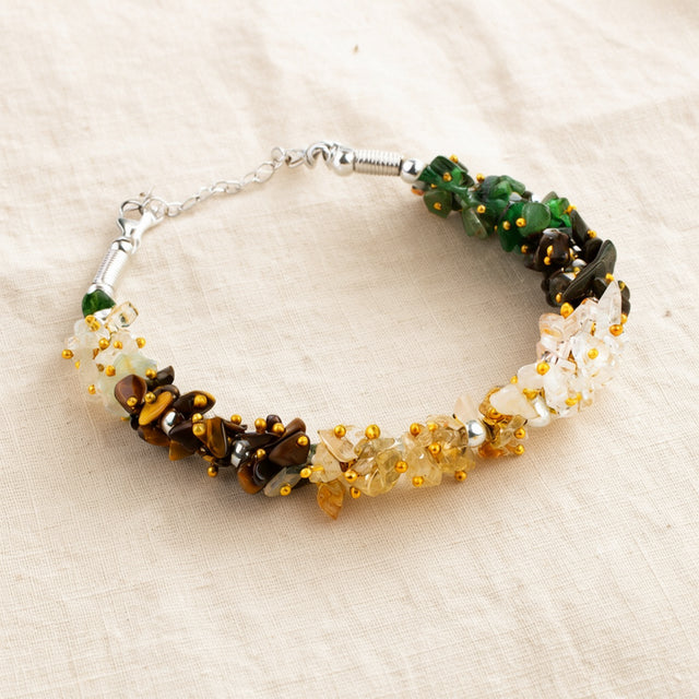 Women Dhan Yog Stone Bracelet laid flat on cream linen